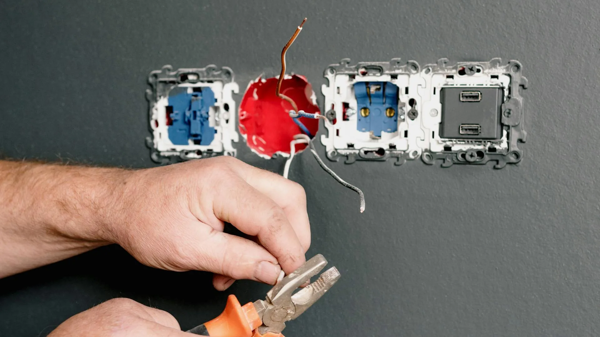 Technician inspecting water heater components during routine maintenance service