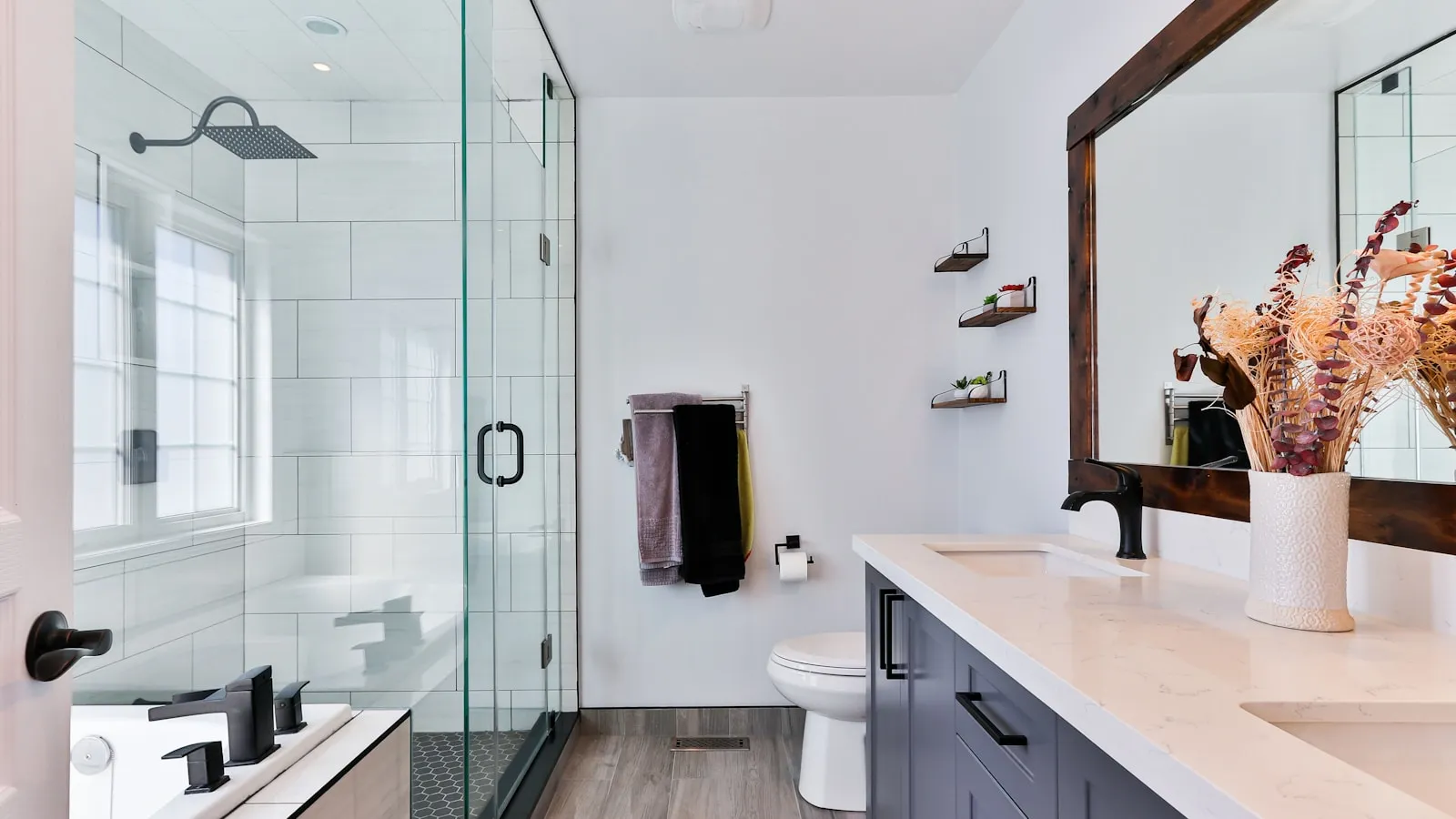 Modern bathroom with sink and shower drains that can become clogged